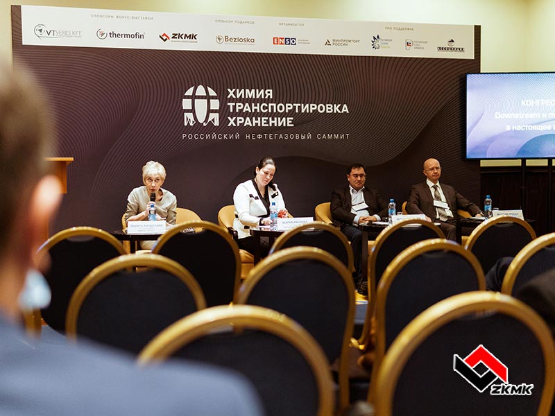 Employees of the West Kazakhstan Engineering Company communicate with visitors of the exhibition